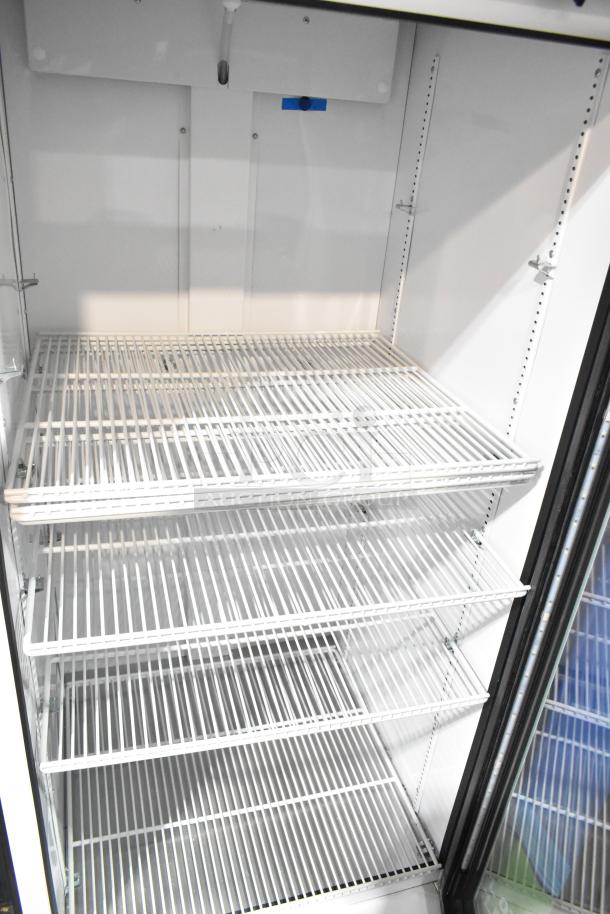 2021 True TSCI-600R-G-PH commercial cooler, single door, 115 volts, 1 phase, features adjustable wire shelves.