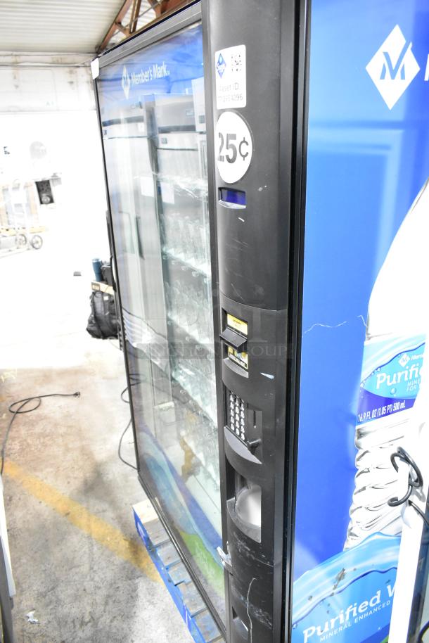 Crane 5800-4 metal vending machine with bill acceptor, 115 volts, 1 phase. Visible wear, 25 cents sticker, asset ID label.