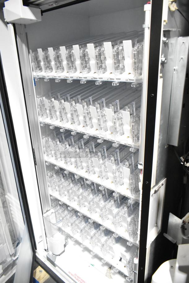 Crane 5800-4 metal commercial bottled drink vending machine with bill acceptor, interior view, excellent condition.
