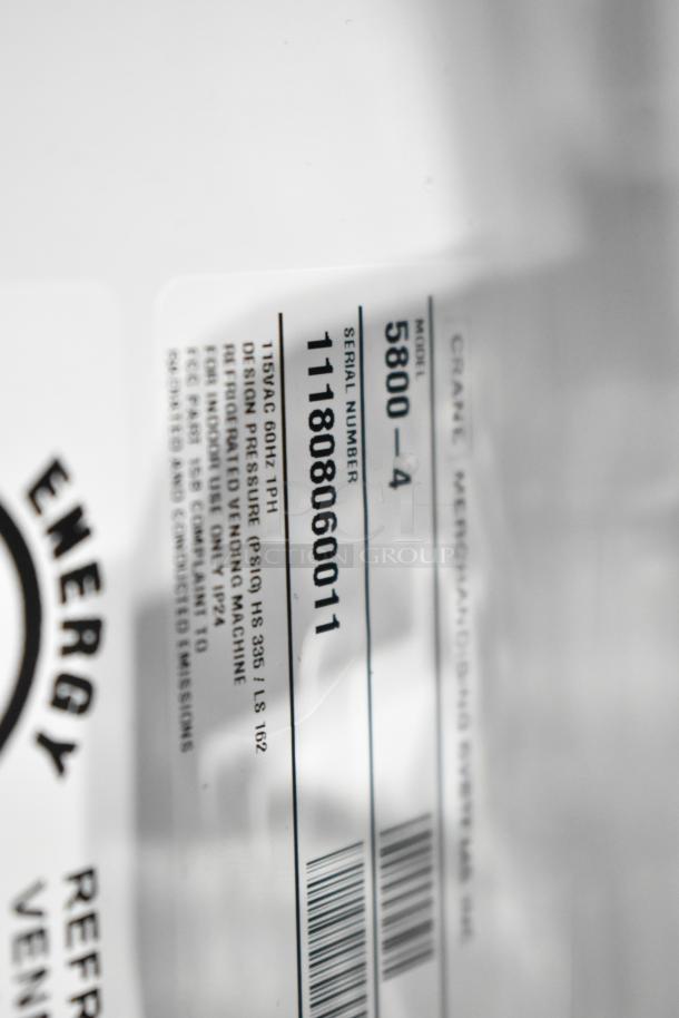 Crane 5800-4 metal commercial vending machine label, showing model, 115 volts, 1 phase details, and serial number.