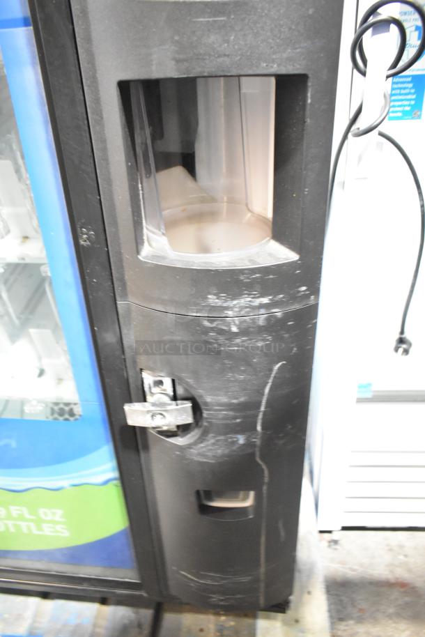 Crane 5800-4 metal commercial drink vending machine with bill acceptor, 115 volts, 1 phase, visible wear on exterior.