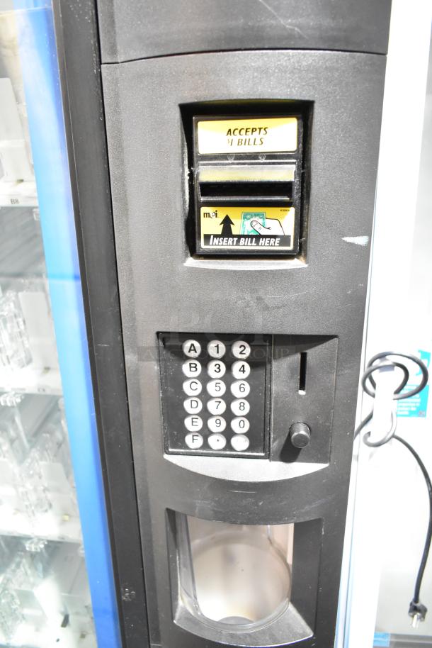 Crane 5800-4 commercial bottled drink vending machine with bill acceptor, keypad. 115 volts, 1 phase, in used condition.