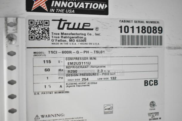 Label on 2021 True TSCI-600R-G-PH Single Door Reach In Cooler. Displays model, voltage, refrigerant type, and serial number.