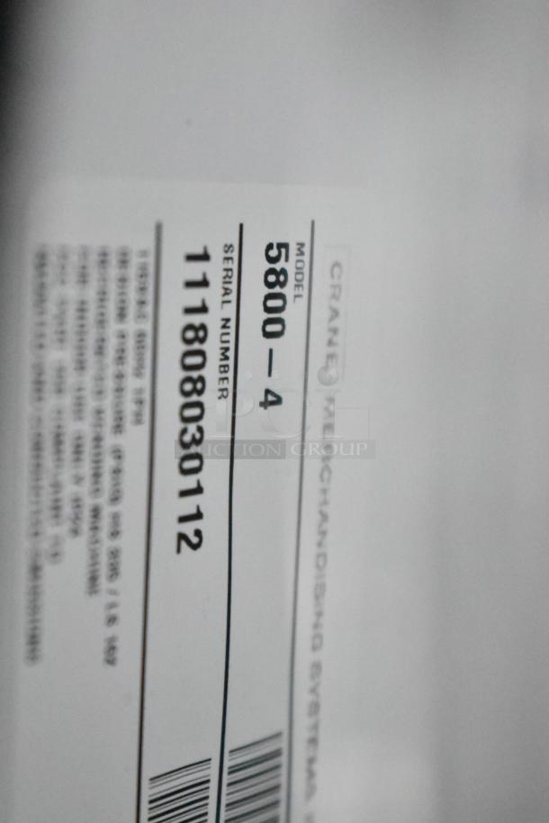 Crane 5800-4 vending machine label showing model and serial number for commercial use.