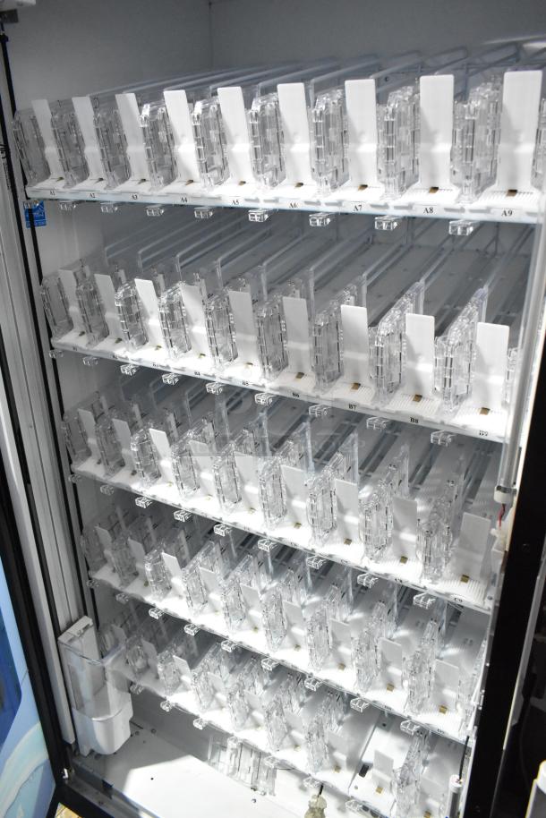 Crane 5800-4 metal commercial drink vending machine with coin and bill acceptor. Visible slots and clear dividers. 115V, 1 Phase.