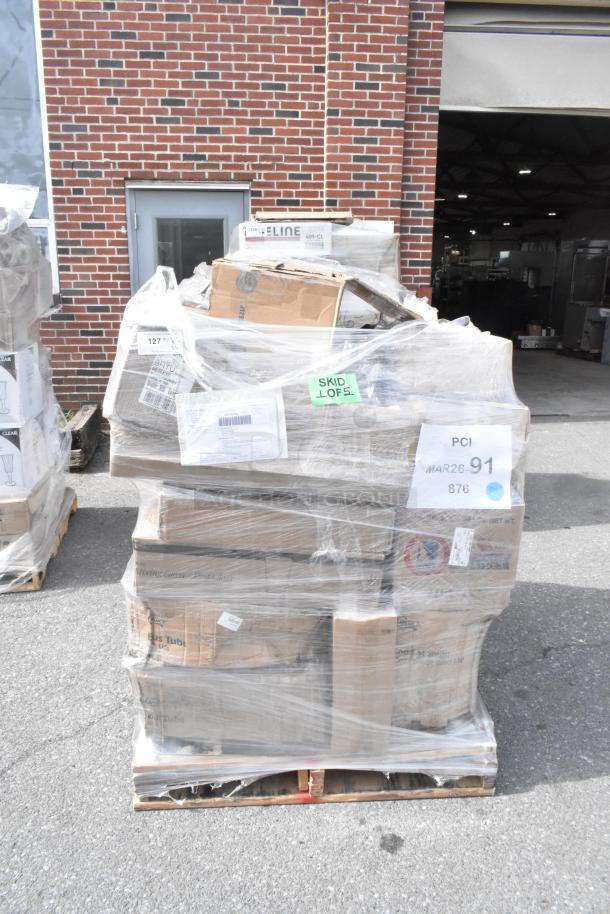 Sealed pallet of 37 new scratch and dent items, including piping tips, serving trays, and glasses. Tags indicate "MAR26-91" and "Skid Lot 5".
