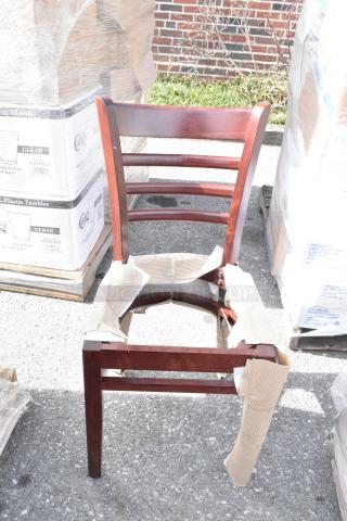 Lancaster Table & Seating mahogany ladder back chair, black vinyl seat detached, brand new scratch and dent, wrapped in packaging.