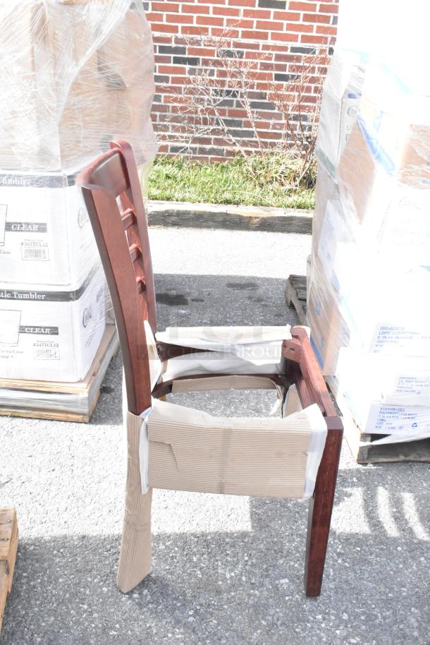 Lancaster Table & Seating mahogany ladder back chair with black vinyl seat, shown with detached seat. Scratch and dent condition.