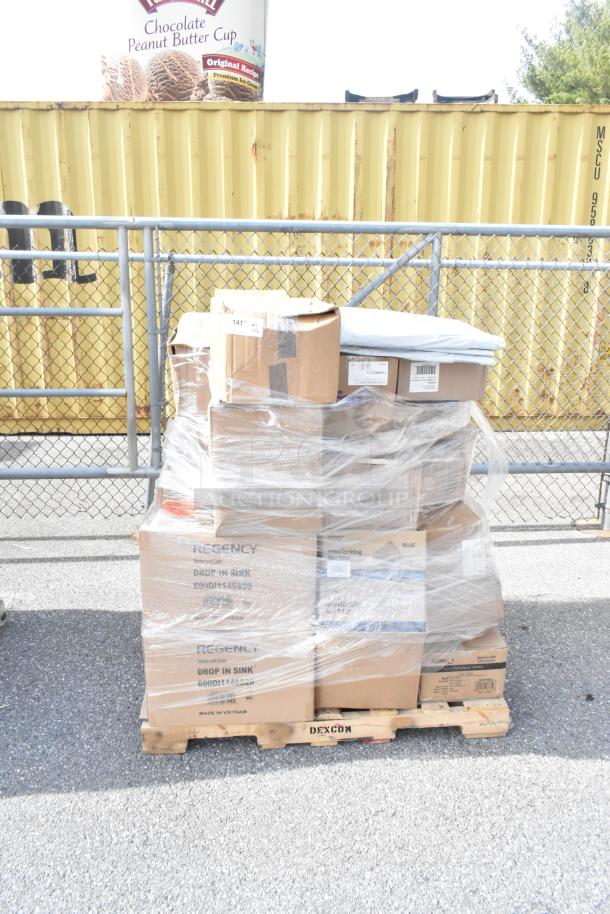 Pallet of new items including teaspoons, cutting board, soup crocks, steam pans. Boxes wrapped in plastic. Marked Regency.