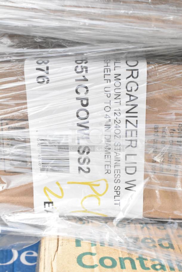 Plastic-wrapped stack showing labels of "Organizer Lid," "Stainless Split," with barcodes and partial text. Scratch and dent condition.