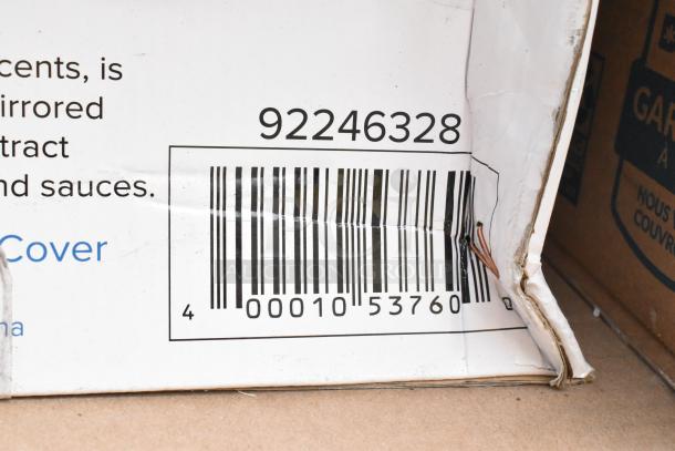 Damaged box with barcode and number 92246328, part of auction lot of 32 new scratch and dent items including a salad spinner.