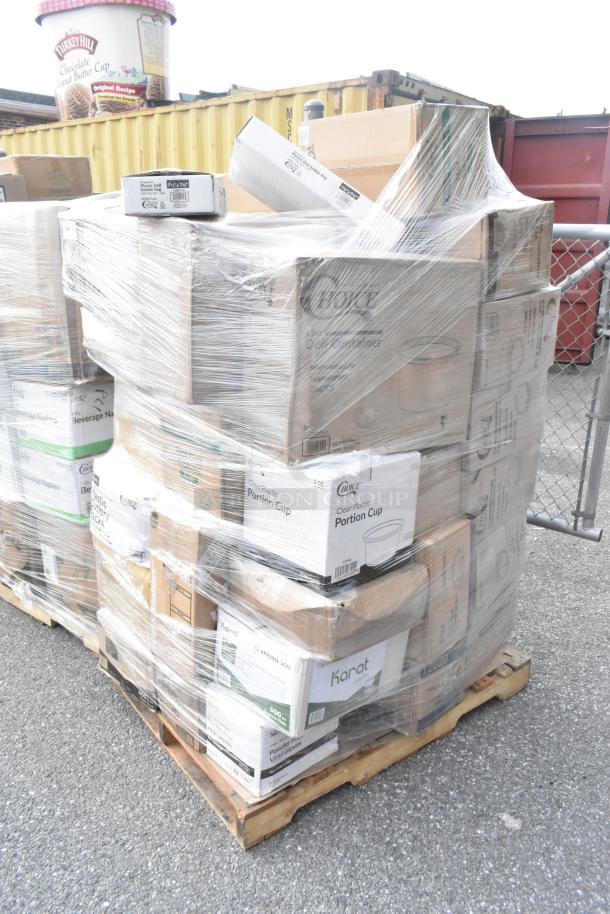 34 brand new scratch and dent items on a pallet including containers, guest towels, bath tissue, shot glasses, shrink-wrapped.