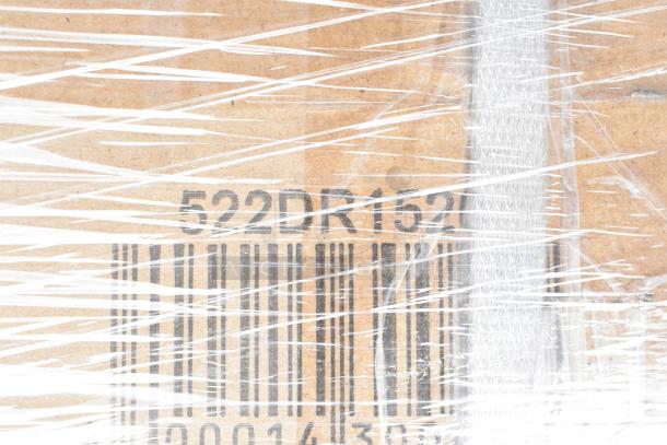 Cardboard box wrapped in plastic with barcode and code "522DR152" visible. Auction lot of 28 scratch and dent items.