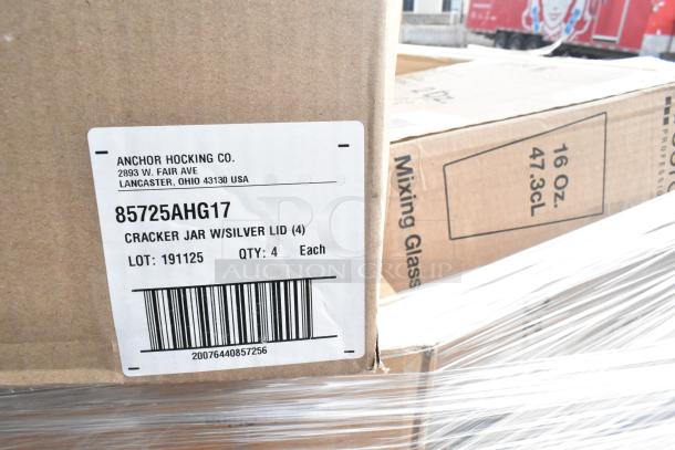 Boxes labeled Anchor Hocking Co., containing cracker jars with silver lids and mixing glasses, 40 brand new items.