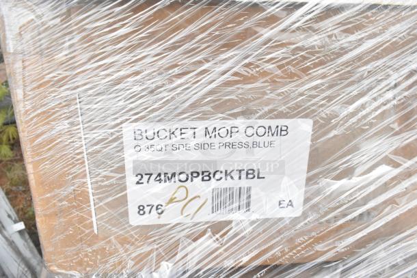 Plastic-wrapped box labeled "Bucket Mop Comb, 35QT Side Press, Blue," part of scratch and dent auction lot.