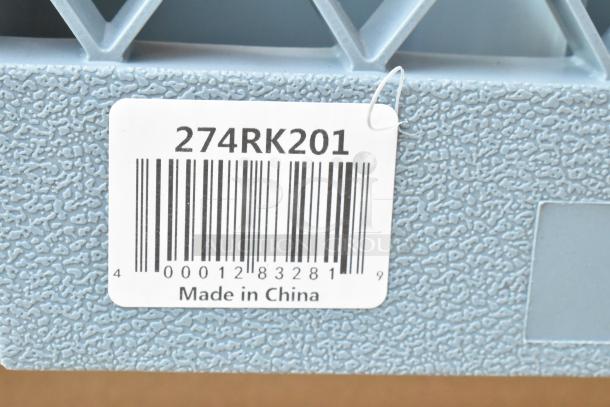 Barcode label with text "274RK201" on blue textured surface, marked "Made in China."