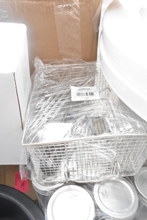 Scratch and dent kitchen items including a fryer basket, barstool cushion, pizza pans, and tumblers, wrapped in plastic.