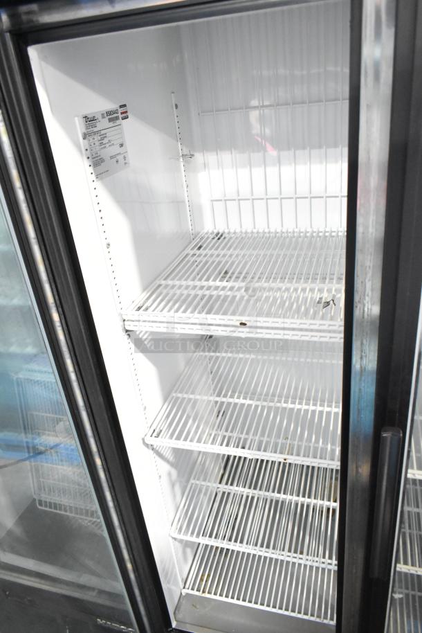 True GDM-35F-LD Commercial 2 Door Reach-In Freezer Merchandiser, features wire shelving, model label visible, 115V, 1 Phase.