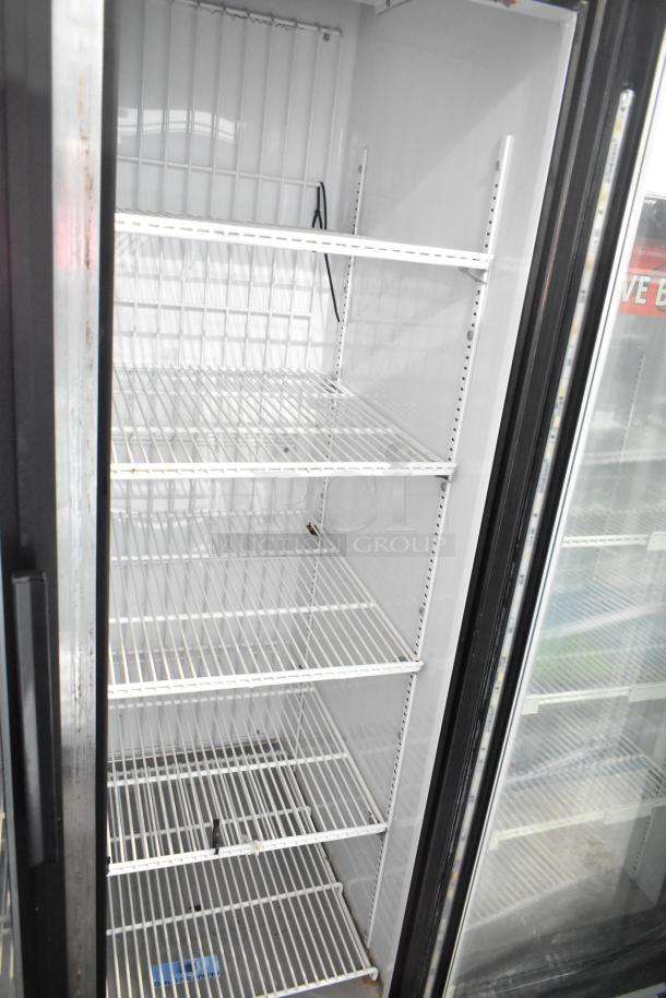 True GDM-35F-LD 2 Door Reach-In Freezer with shelves, sturdy metal frame, 115 Volts, 1 Phase, ideal for commercial use.