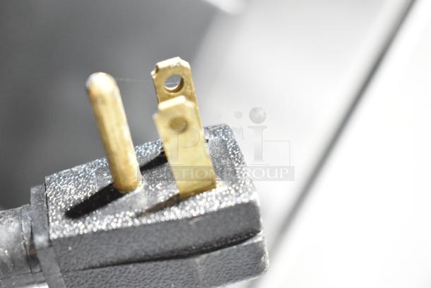 Close-up of the power plug for True GDM-35F-LD Freezer Merchandiser, showing a 115V, 1 phase connection.