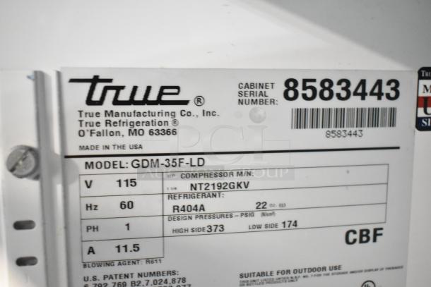 True GDM-35F-LD freezer label showing model, voltage, compressor details; commercial freezer; 115V, 1 phase; serial number 8583443.
