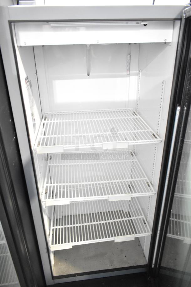 2023 True GDM-12-HC single door reach-in cooler merchandiser, 115V, 1 phase, excellent condition, interior shelves visible.