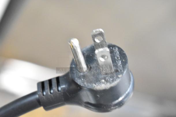 Close-up of power plug for a 2021 True TSCI-600R-G-PH Reach In Cooler, 115 volts, 1 phase.