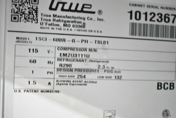 2021 True TSCI-600R-G-PH commercial cooler, 115V, 1 phase, model tag with compressor info and refrigerant details.