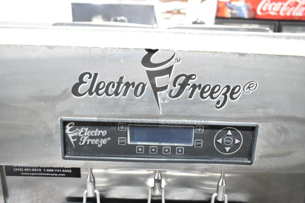 Electro Freeze SLX400E-137 soft serve machine, stainless steel, control panel display, dual flavor with twist, commercial casters.