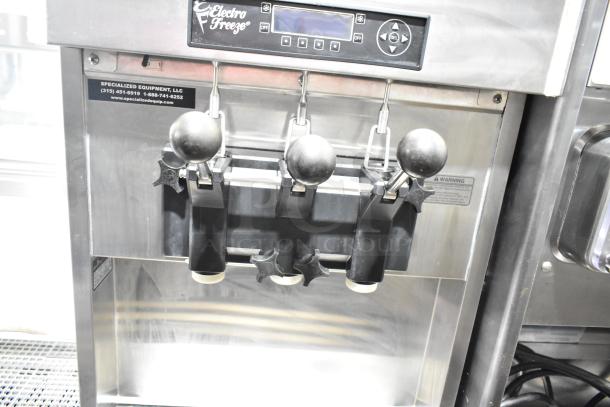 Electro Freeze SLX400E-137 soft serve machine, 2-flavor with twist, water-cooled, commercial casters, digital controls.