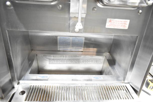 Taylor 342D-27 stainless steel frozen beverage machine, 2 flavors, drink mixer, air-cooled, on commercial casters. Visible labels indicate caution and usage.