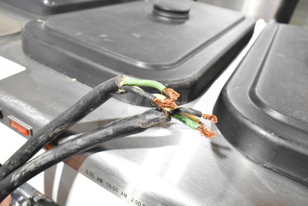 Taylor 342D-27 frozen beverage machine wiring detail, showing exposed wires. Stainless steel body, 208-230V, 1 phase.