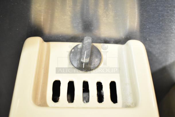 Silver King Commercial 3 Head Frozen Drink Mixer base, showing a metal switch and ventilation openings. Used condition.