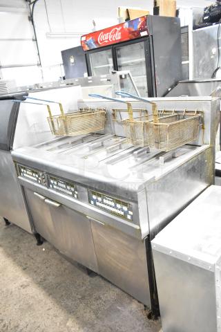 Frymaster BIGLA330-6CSD 3-bay deep fryer, 105,000 BTU, with filtration system on commercial casters, moderate wear.