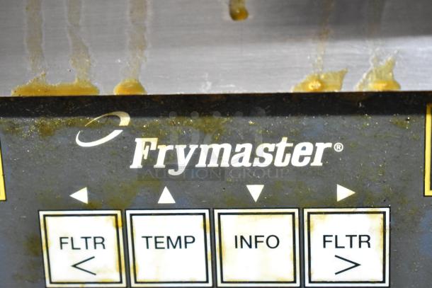 Frymaster BIGLA330-6CSD control panel with labels: FLTR, TEMP, INFO. Visible wear and grease marks.