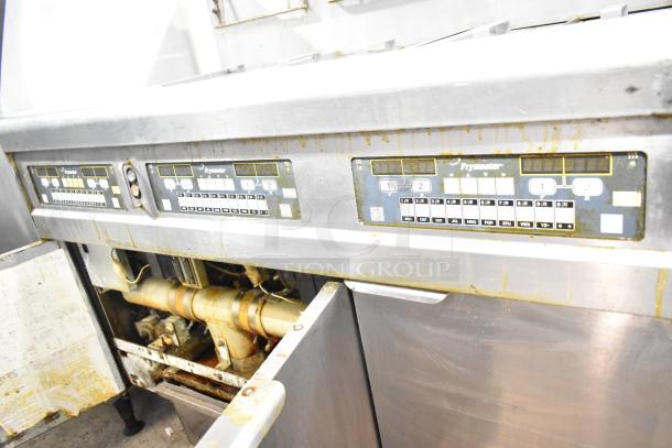 Frymaster BIGLA330-6CSD 3-bay fryer with filtration, 105,000 BTU, natural gas, on casters. Used condition with control panels shown.