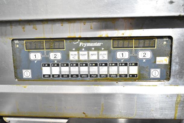 Frymaster BIGLA330-6CSD control panel; commercial gas fryer; 3 bays; filtration system; worn condition; digital display.