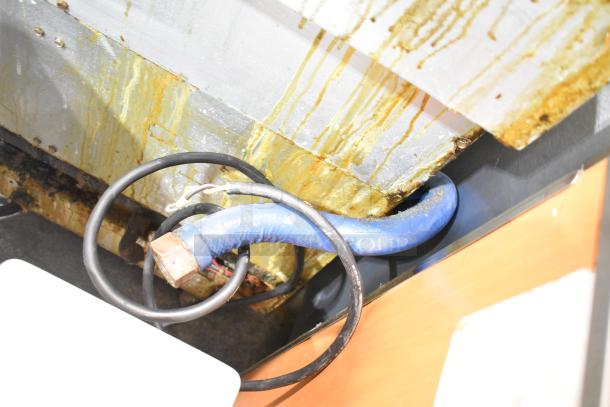 Frymaster BIGLA330-6CSD fryer, natural gas, 3-bay, 105,000 BTU, filtration system, commercial casters, visible wear.