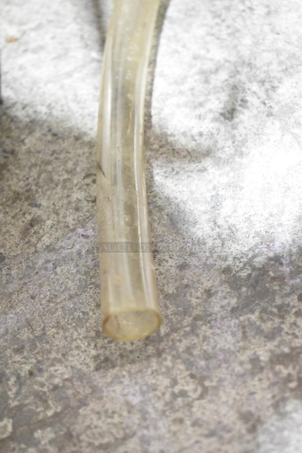 Hatsuyuki HF50DC Ice Shaver hose detail on gray countertop, showing wear.