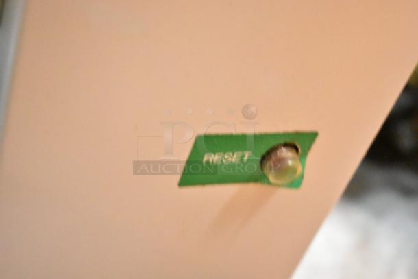 Hatsuyuki HF50DC ice shaver reset button on a green label, indicating reset function.