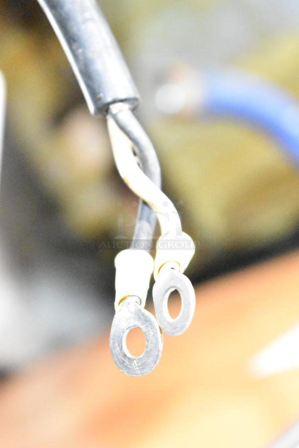 Hatsuyuki HF50DC ice shaver wires with two metal ring terminals, showing some wear, indicating electrical connections.