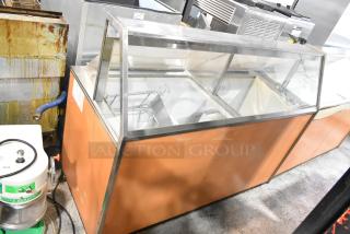 Commercial ice cream dipping cabinet with metal tub collars, 115 volts, 1 phase, wood exterior, good condition.