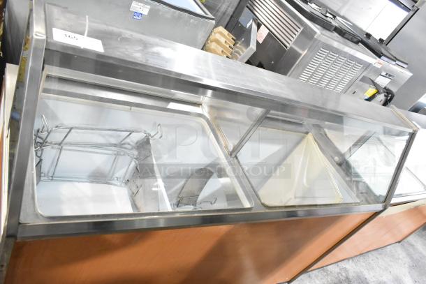 Commercial ice cream dipping cabinet with metal tub collars, clear viewing panels, 115 volts, 1 phase, used condition.