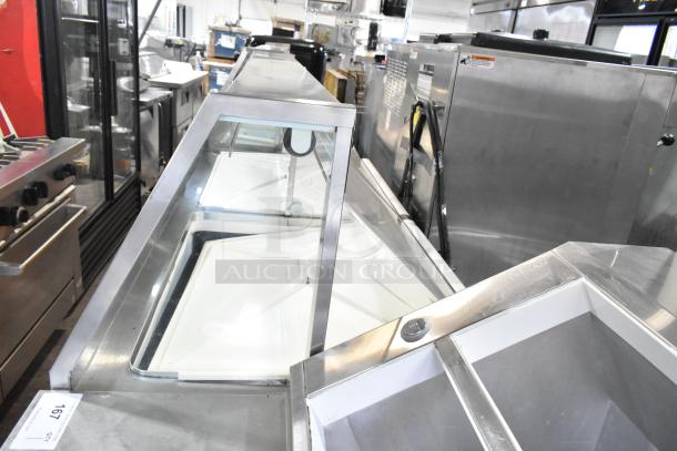 Commercial ice cream dipping cabinet, stainless steel, 115 volts, 1 phase, with glass sliding top, used condition.