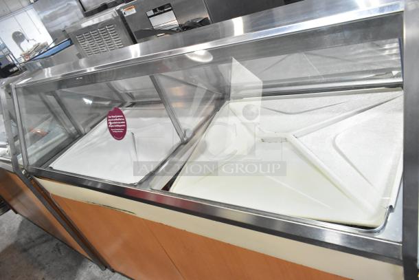 Commercial ice cream dipping cabinet, 115 volts, 1 phase, stainless steel, with glass display; excellent condition.