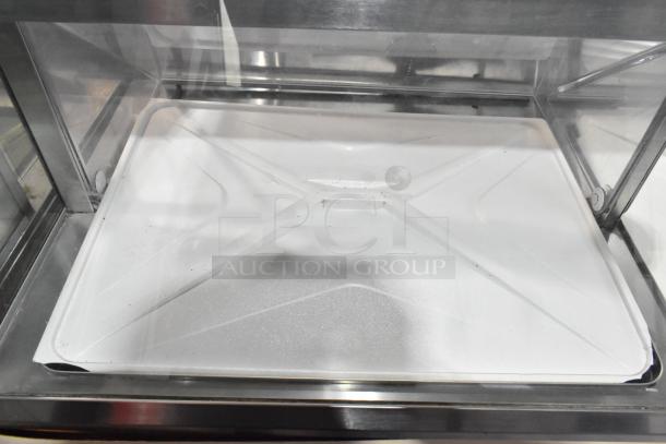 Commercial ice cream dipping cabinet, 115 volts, 1 phase, stainless steel exterior, clear top, excellent condition.