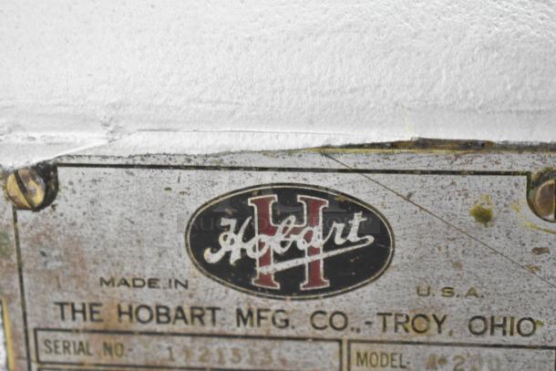 Hobart A200 mixer label showing brand logo, serial number, and model details, indicating manufacturing origin in Troy, Ohio.