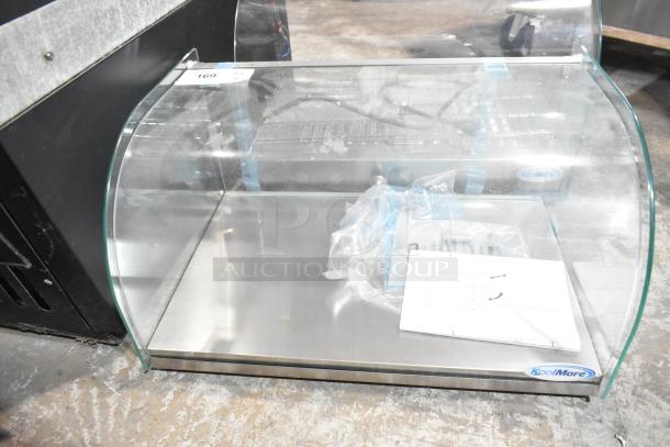 KoolMore DC-1C countertop bakery display case, new, with curved glass front, rear door, 0.9 cu. ft. Scratch and dent condition.