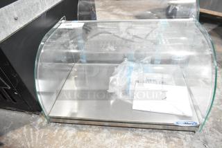 KoolMore DC-1C countertop bakery display case, new, with curved glass front, rear door, 0.9 cu. ft. Scratch and dent condition.