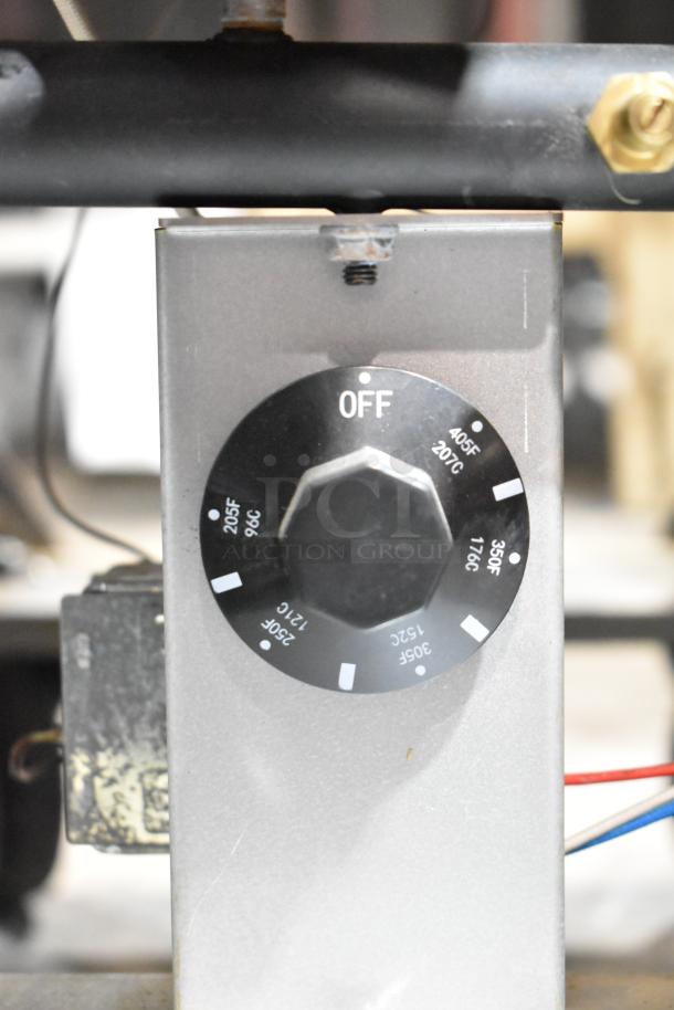 Close-up of Cook Rite ATFS-40 fryer thermostat dial showing temperature settings from 205°F to 405°F.